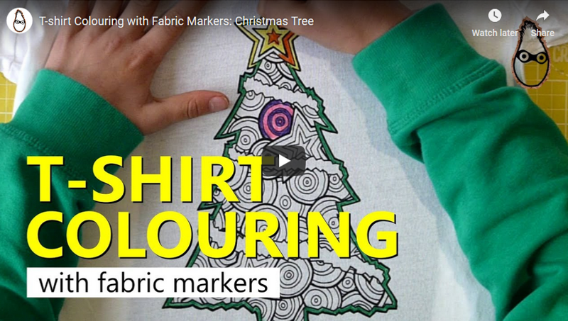 Watch a Christmas Tree t-shirt design being colored in with fabric markers